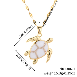 Detail view of gold turtle pendant necklace with white shell inlay and size dimensions