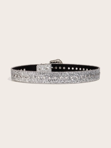 Sparkling silver rhinestone belt with star cutouts and decorative buckle on beige backdrop