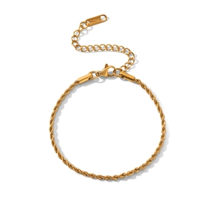 Detailed macro view of 18K gold-plated stainless steel rope chain bracelet with lobster clasp