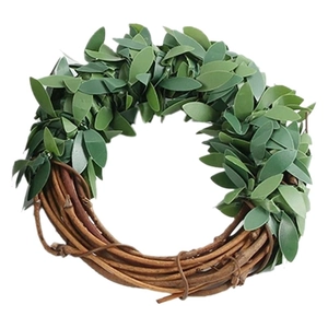 Leaf-shaped woven napkin ring with green foliage and brown branch design for table setting