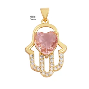 Macro view of Hamsa Hand pendant with pink heart stone and detailed measurements