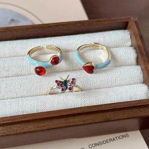 French enamel butterfly and red heart adjustable gold ring set in a wooden jewelry box