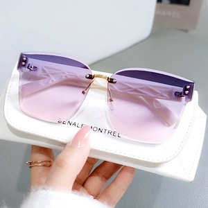 Frameless oversized sunglasses with purple gradient lenses and textured temples for women