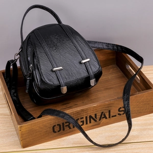 Retro black PU leather mini crossbody bag with multi-compartments and round silhouette