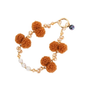 Champagne crystal beaded keychain with brown faux fur pom pom on white background