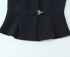 Macro detail of high-density black fabric with a premium gold metal buckle adjustment