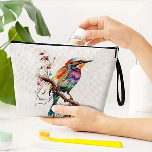 Linen makeup bag with colorful kingfisher print and black zipper strap detail
