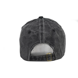 Detail view of washed cotton baseball cap featuring vintage buckle and white stitching