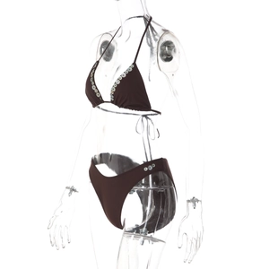 Close-up of dark brown bikini set with shell button details on mannequin