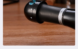Detail of black mini champagne stopper with twist lock icon on Moscato wine bottle