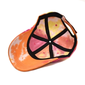 Detail view of tie-dye baseball cap interior showing reinforced seams and six-panel structure