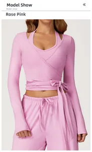 Rose pink wrap-style yoga top with matching wide-leg pants for fitness and dance wear