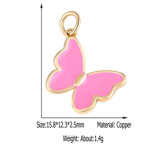 Detailed view of a pink butterfly pendant with gold frame and copper zircon material