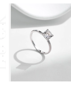 Macro shot of 1 carat princess cut moissanite ring with classic four-prong setting