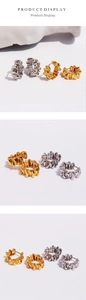 Detail showing high-shine gold and silver hoop earrings with irregular wrinkled texture