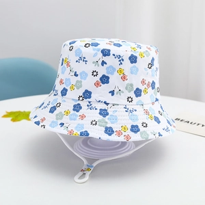 Detail of floral kids sun hat showing adjustable chin strap and reinforced stitching