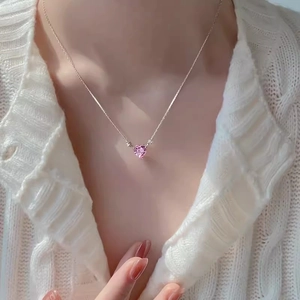 Pink heart pendant necklace with silver chain on model, minimalist elegant jewelry