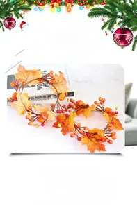 Detailed view of harvest candle ring with maple leaves, pumpkins, and berries
