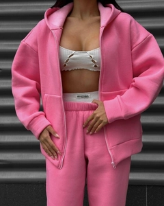 Close-up of pink zip-up hoodie and high-waisted jogger set with a soft cotton texture