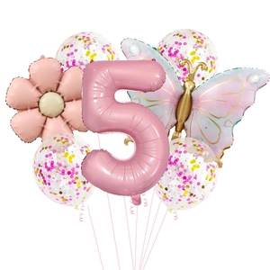 Detail of pink number 5 balloon with flower and butterfly foil shapes for party