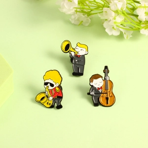 Cartoon enamel brooch set featuring jazz musicians playing trumpet, cello, and saxophone