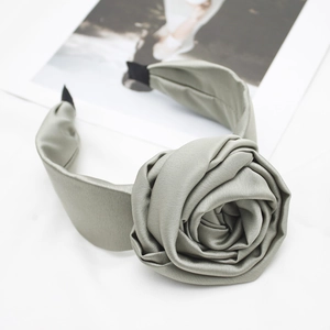 Elegant grey-green wide satin headband with a large decorative fabric rose flower