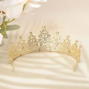Detailed close-up of luxury gold bridal tiara with intricate filigree and crystal accents