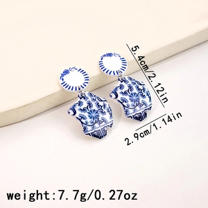 Detailed view of blue and white floral acrylic earrings with 5.4cm x 2.9cm dimensions