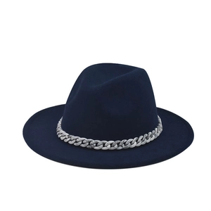 Detail of navy wide-brim wool fedora hat featuring a chunky marble pattern decorative chain