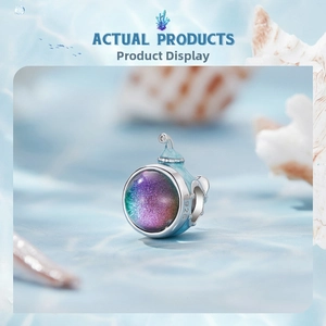 Macro view of S925 sterling silver ocean charm featuring a dreamy cosmic blue nebula effect