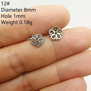 Macro shot of 8mm vintage hollow floral bead spacer for DIY jewelry making