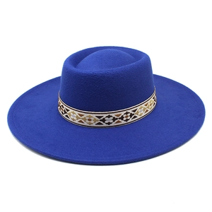 Detail of royal blue wool felt fedora featuring a colorful ethnic embroidery hat band