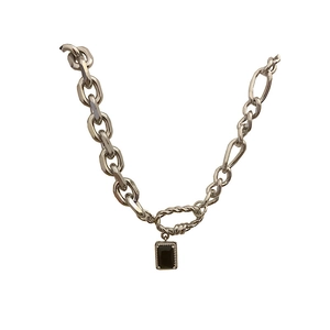 Minimalist silver chain necklace with geometric black pendant and rhinestone details