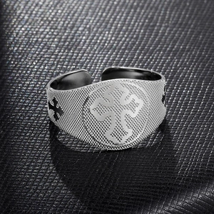 Vintage silver stainless steel cross ring with textured grid pattern and religious motif