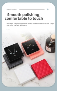 Detailed view of square jewelry boxes with diamond texture and soft velvet interior