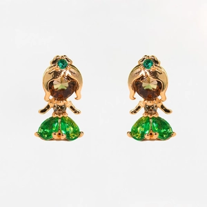 Detail of gold princess earrings featuring green faceted stones and zircon inlay