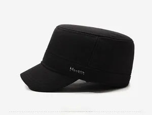 Side view detail of black flat top cap with fleece lining and metal logo plate