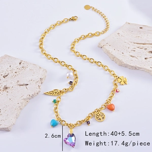 Detail showing gold heart pendant and tree of life charms with length 40+5.5cm