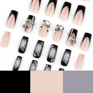 French black press-on nails with silver crosses, glitter, and 3D wave details