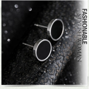 Macro shot of black opal barbell earrings with polished silver stainless steel frames