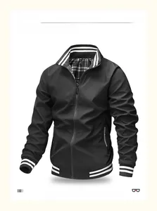 Close-up of black stand-up collar jacket with striped ribbing and checkered lining detail