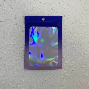 Detail of blue gradient laser packaging bag with resealable zip lock and hanging hole