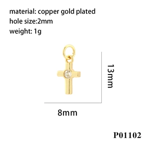 Detailed view of 13x8mm gold plated copper cross pendant with zircon stone insert