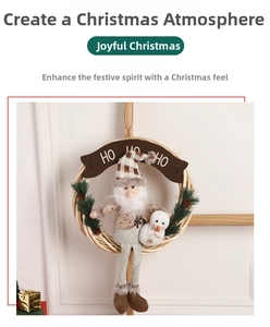 Close-up of beige woven wreath with long-legged doll and HO HO HO banner for Xmas