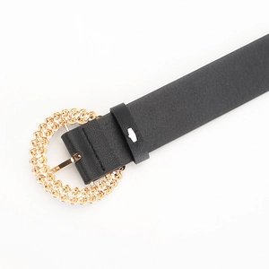 Women's black leather belt with a vintage gold circular embossed buckle and rhinestones