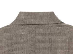 Detail view of the brown tweed blazer collar and back stitching on double-breasted suit