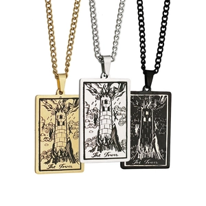 Detailed view of The Tower Tarot rectangular pendants in gold, silver, and black finishes