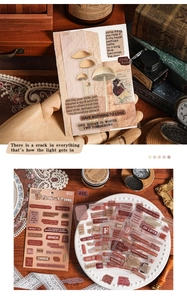 Detail of vintage waterproof PET stickers with retro phrases and botanical illustrations