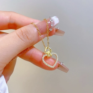 Luxurious gold titanium steel necklace with double heart pendant and sparkling crystals