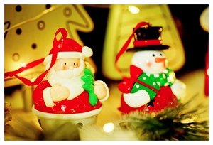 Detailed view of Santa and Snowman bells with silk ribbons for Christmas tree decor